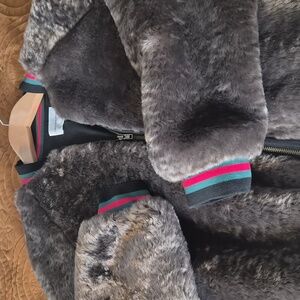 Cozy Brown Faux Fur Jacket with pockets and stripe accents